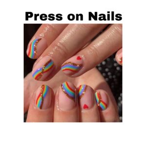 A set of vibrant rainbow press on nails featuring short square shapes and glossy heart designs.