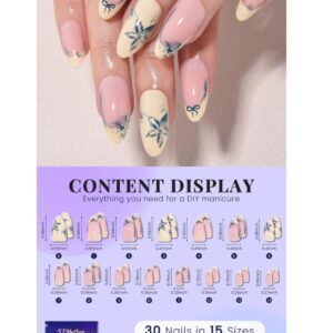 Stylish blue French tip press on nails in a medium almond shape with floral accents, perfect for a salon-quality manicure.