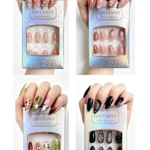 Short almond press on nails with white polka dot 3D floral designs for a salon-grade manicure.